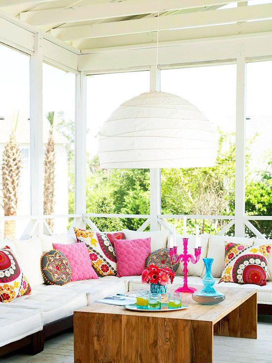 Use colorful cushions for a vibrant touch on your Screened Porch seating