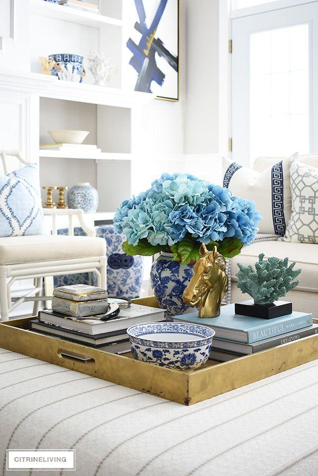 Use decorative trays to organize items in your blue living room