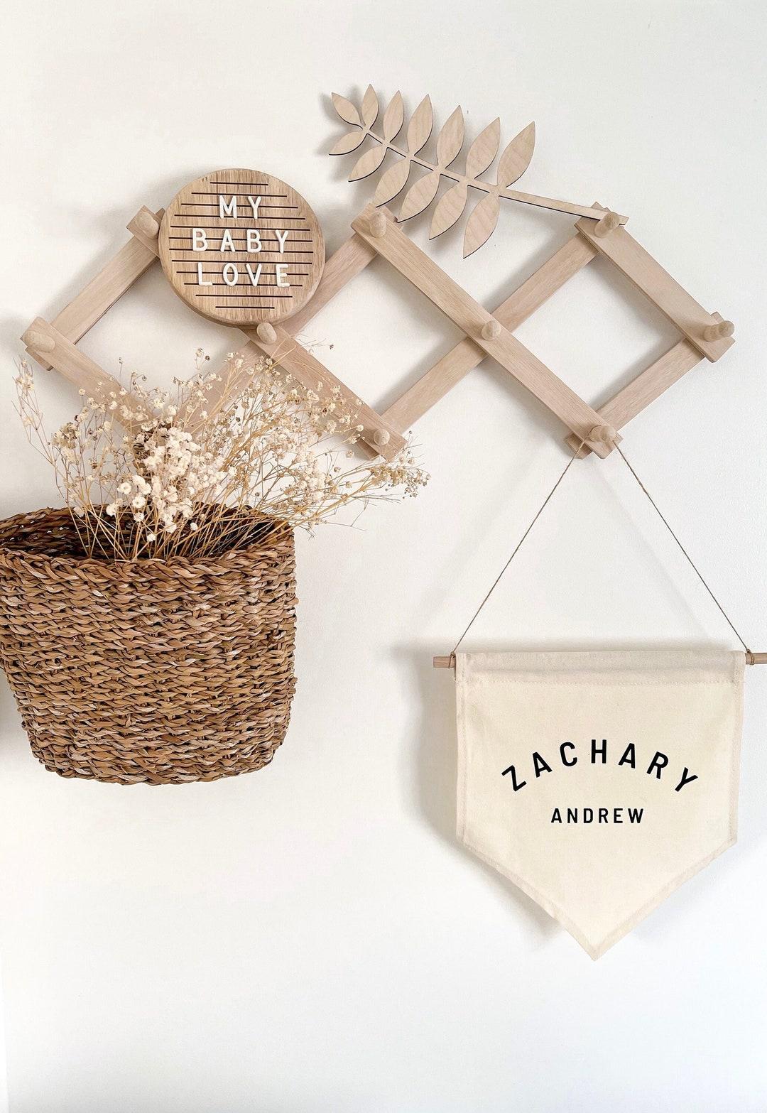 Use a peg rail for hanging essentials in your small nursery