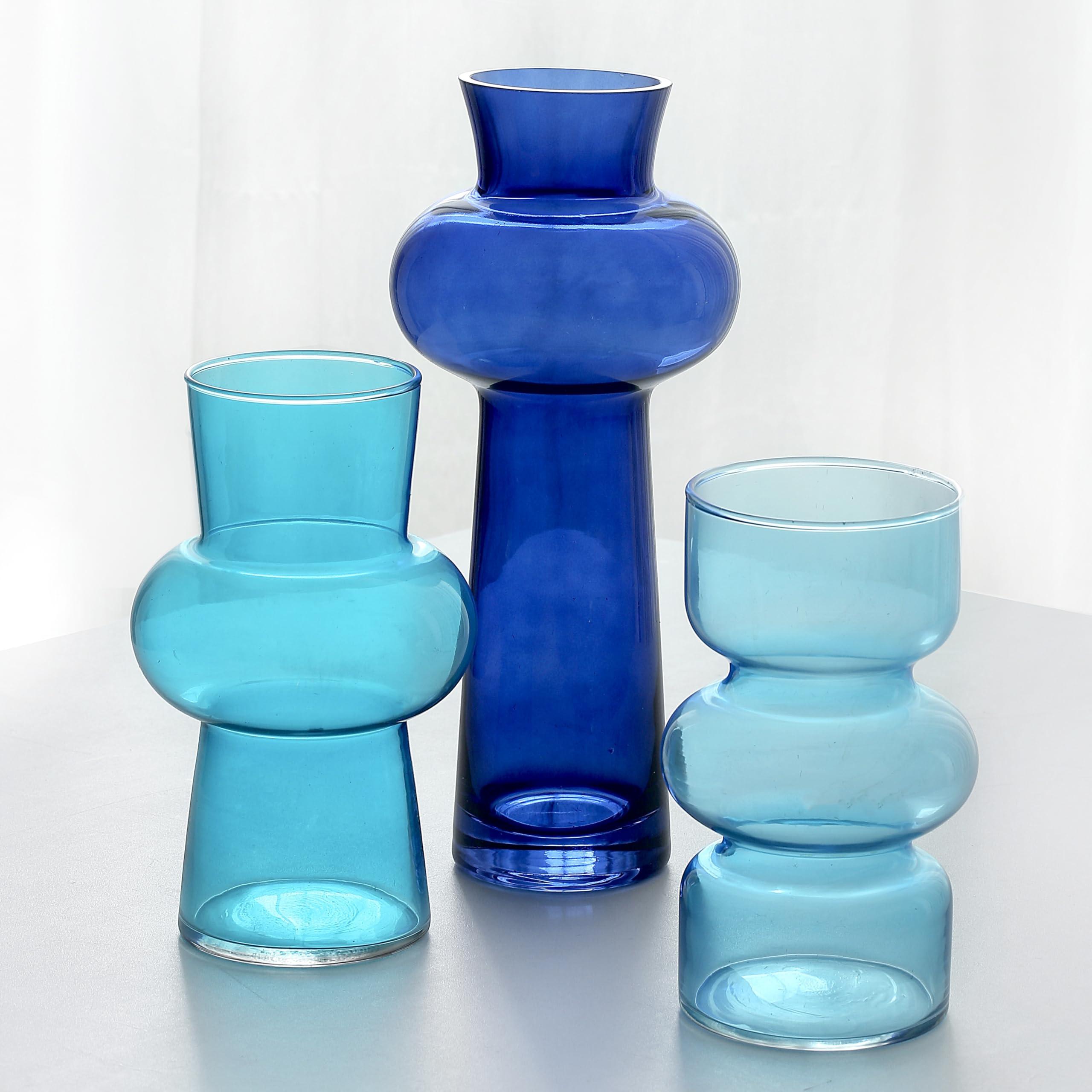 Opt for blue-tinted glass vases as stylish decor in your living room