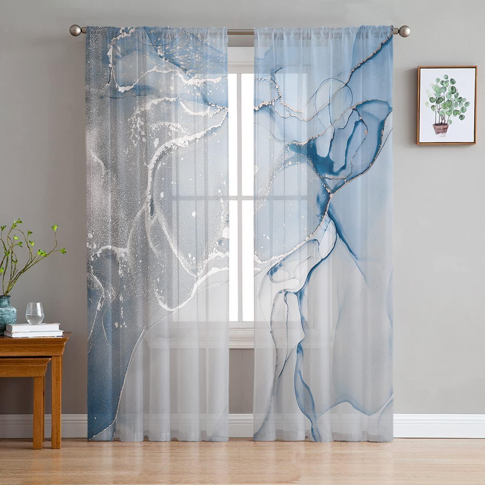 Install sheer curtains for soft light in a blue living room