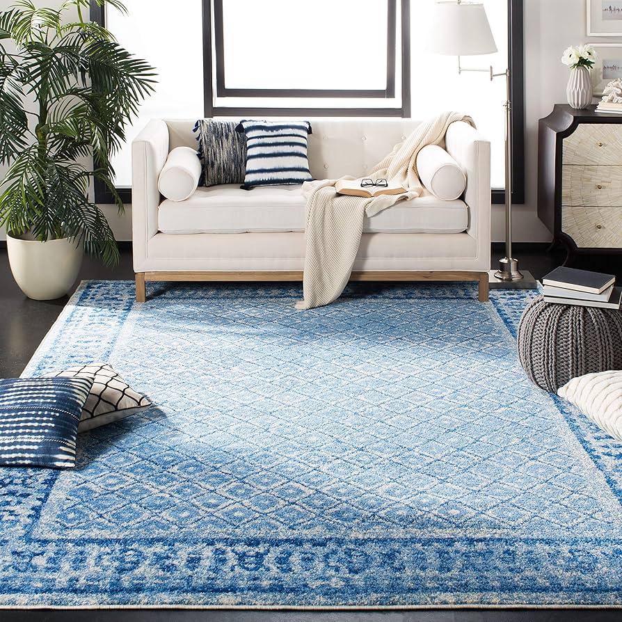 Use a bold blue rug to anchor the blue living room