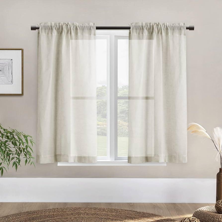 Adorn windows with sheer curtains for soft, diffused light in your Farmhouse Bathroom