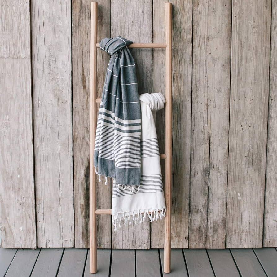 Use a vintage ladder for stylish towel storage in boho bathrooms