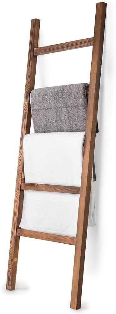 Incorporate a wooden bathroom ladder for elegant towel storage without compromising style