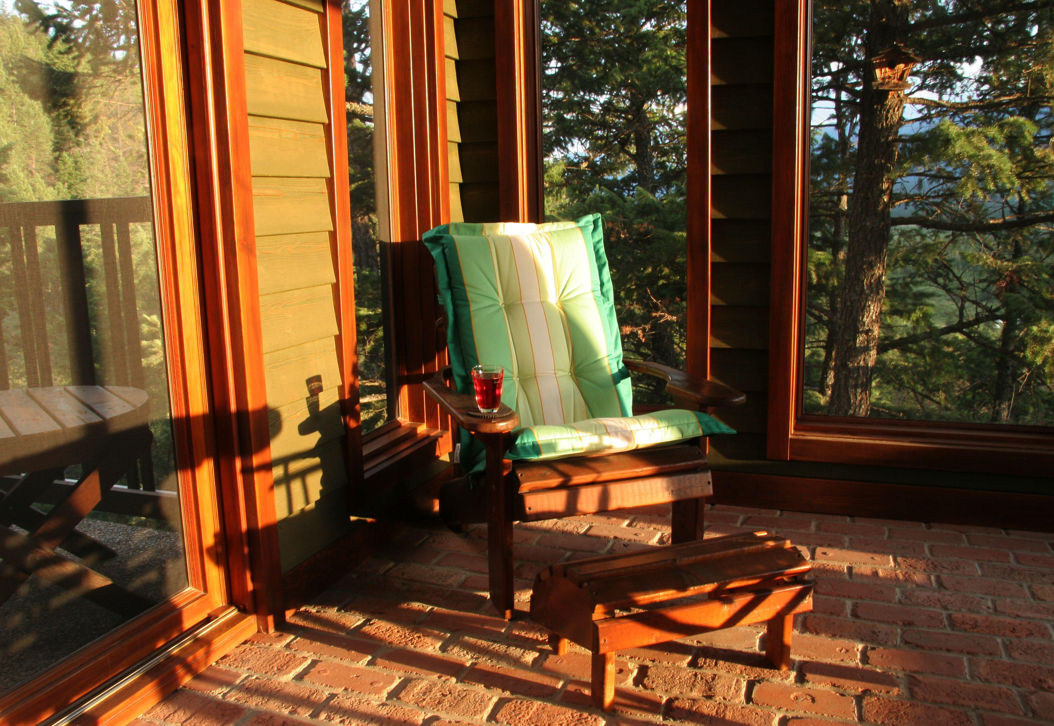 Set up a reading nook in your screened porch with a comfy chair