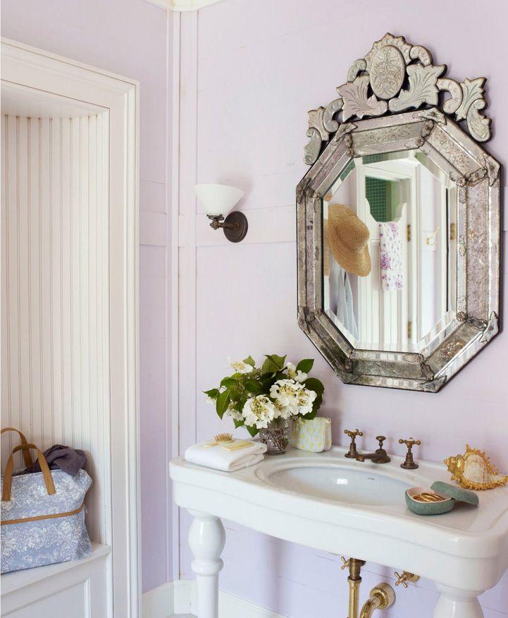 Hang pastel mirrors to open up and brighten the bathroom