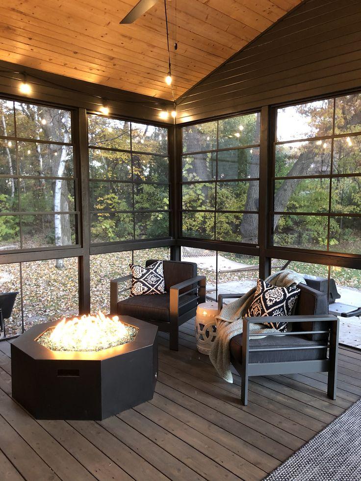 Introduce a fire pit for warmth and conversation on your Screened Porch