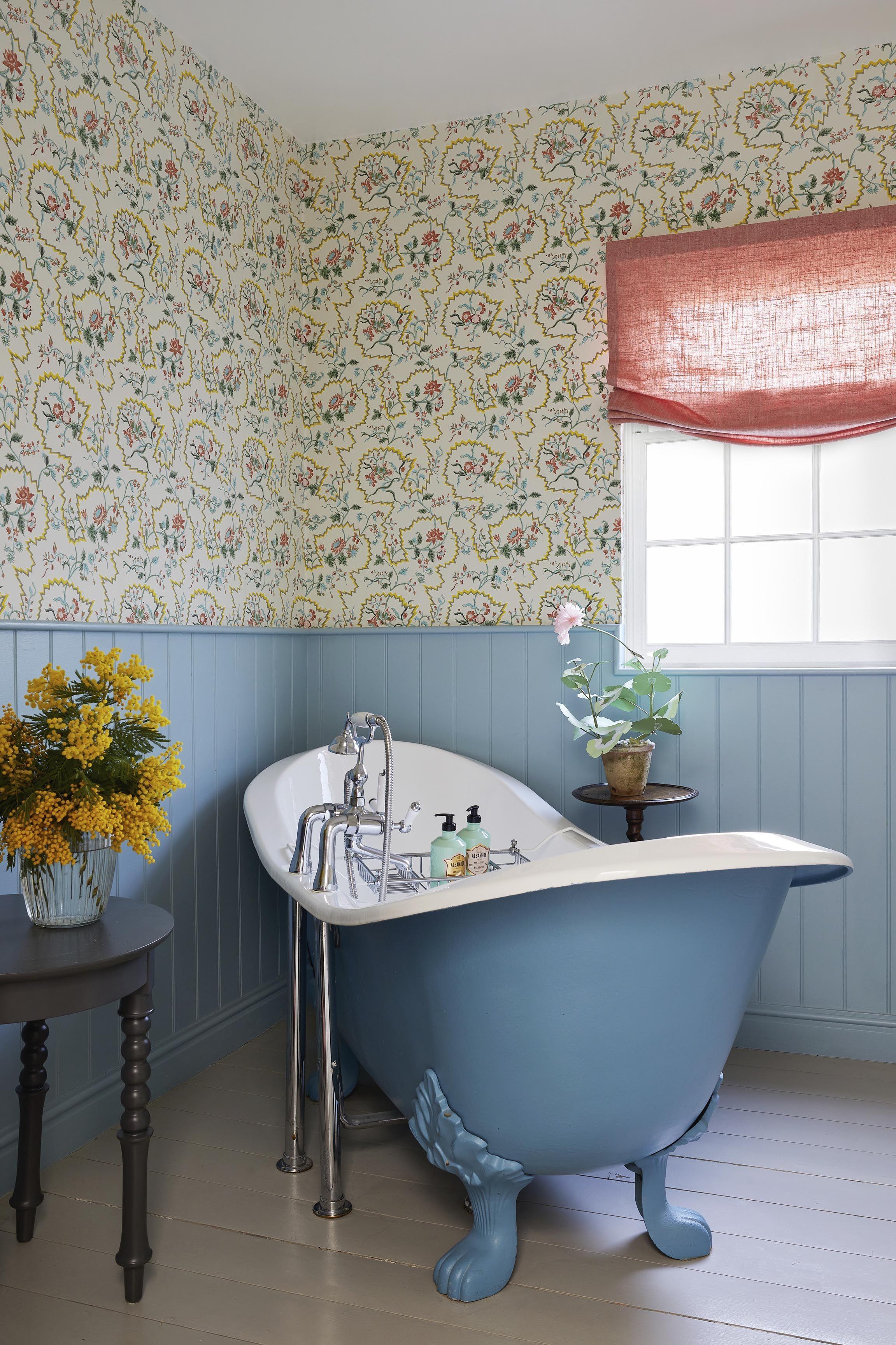 Bold wallpaper adds character and flair to your farmhouse bathroom walls