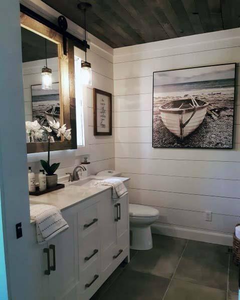 Shiplap walls evoke rustic charm in your Chalet Bathroom