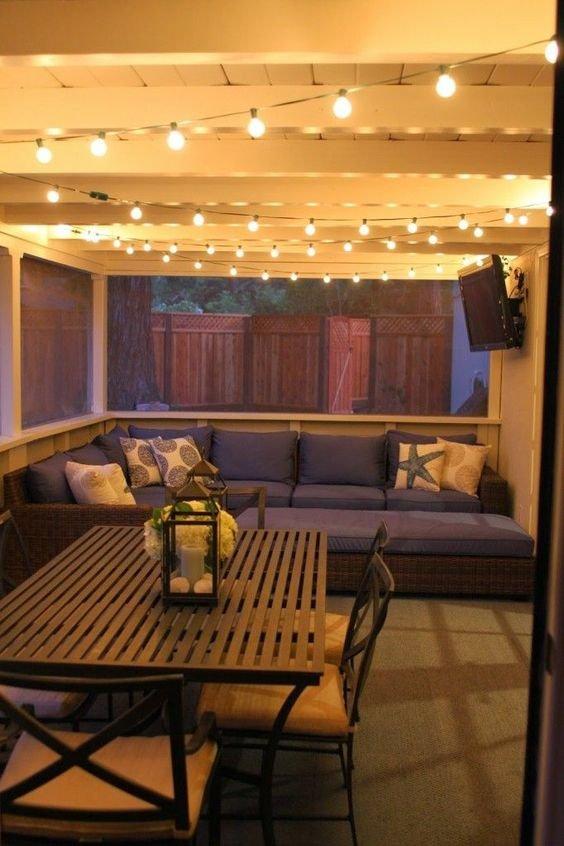 Hang string lights to illuminate your Screened Porch with enchanting ambiance