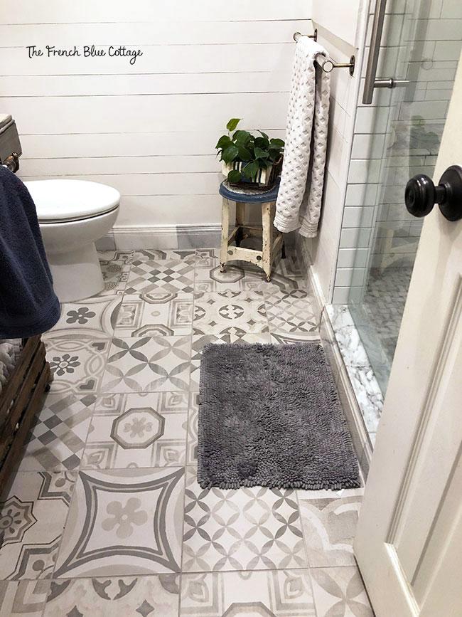 Use patterned tiles to add personality to your farmhouse bathroom floor