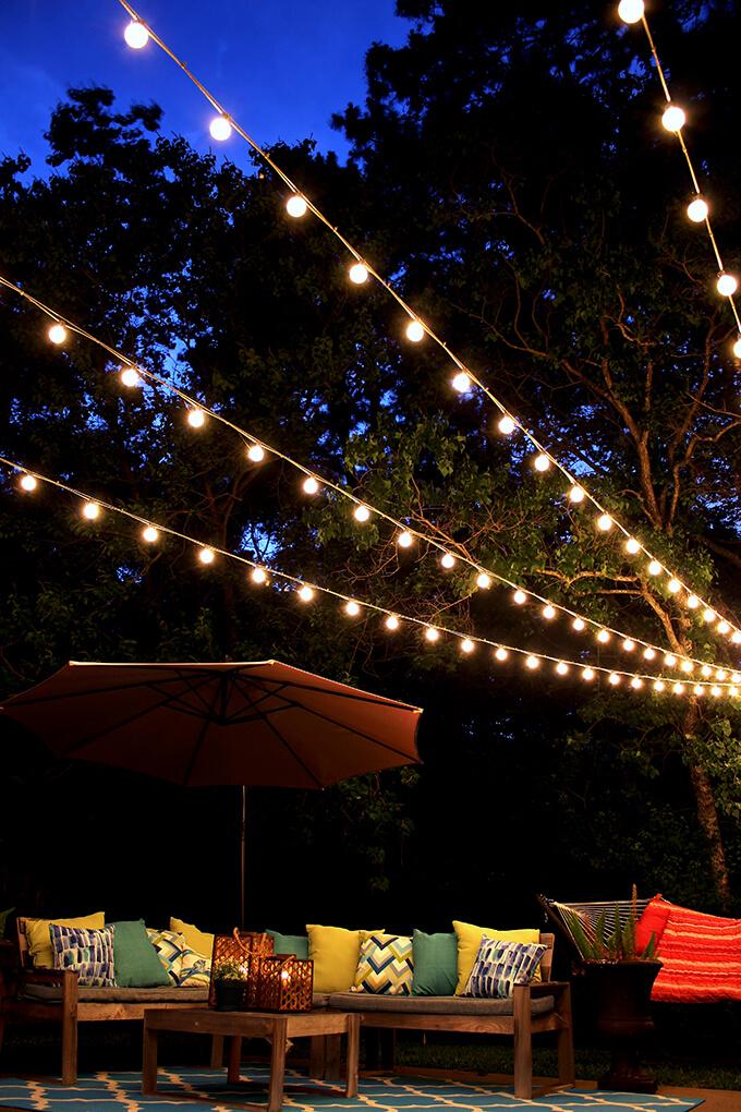 Install string lights to create magical evenings in your backyard