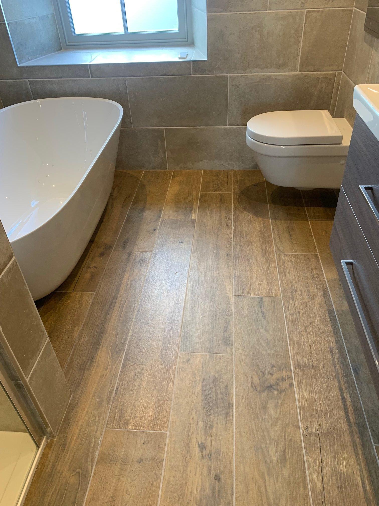 Use wooden flooring to add a touch of nature to your wooden bathroom