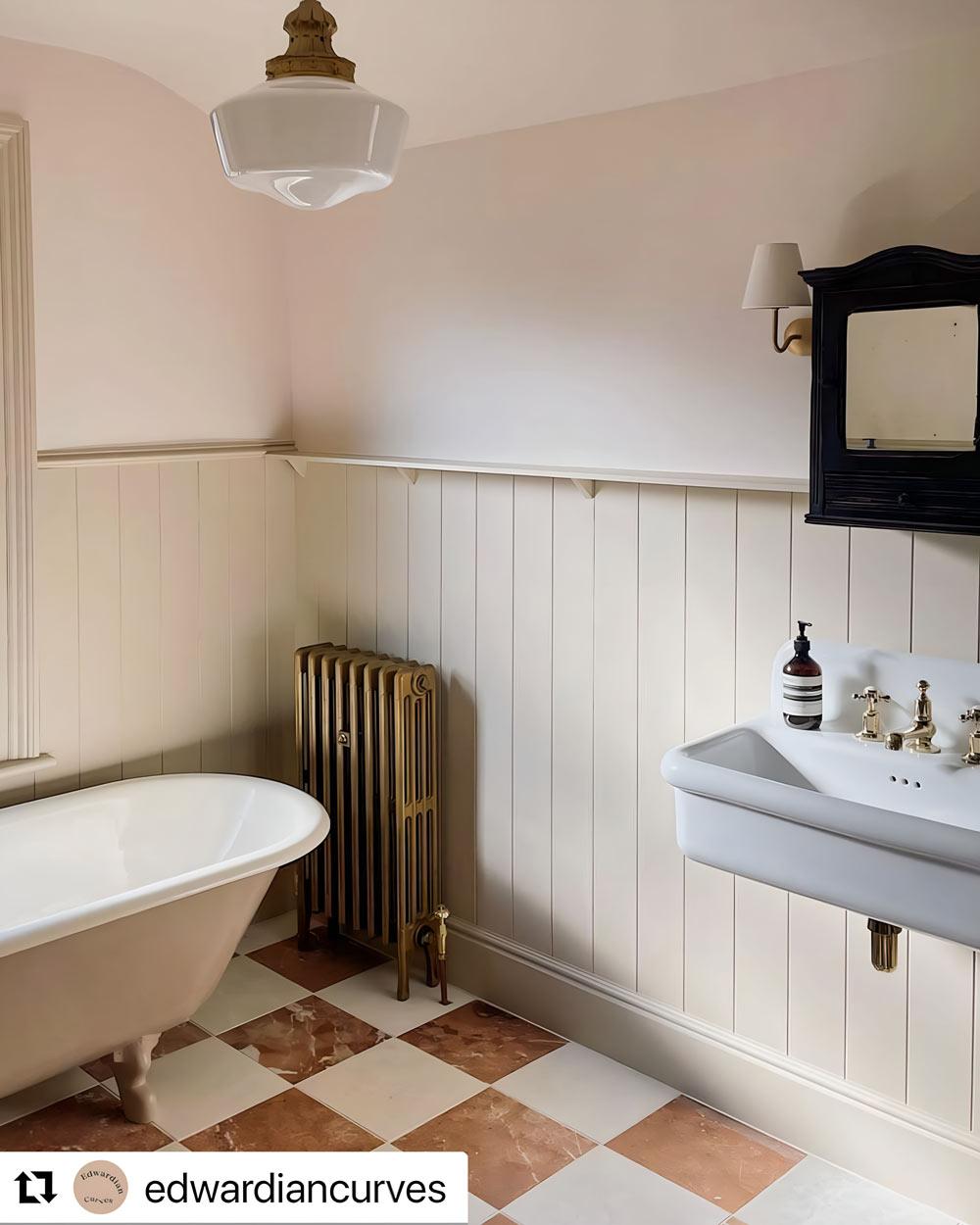 Wood-paneled walls can warm up any bathroom, elevating its overall aesthetic