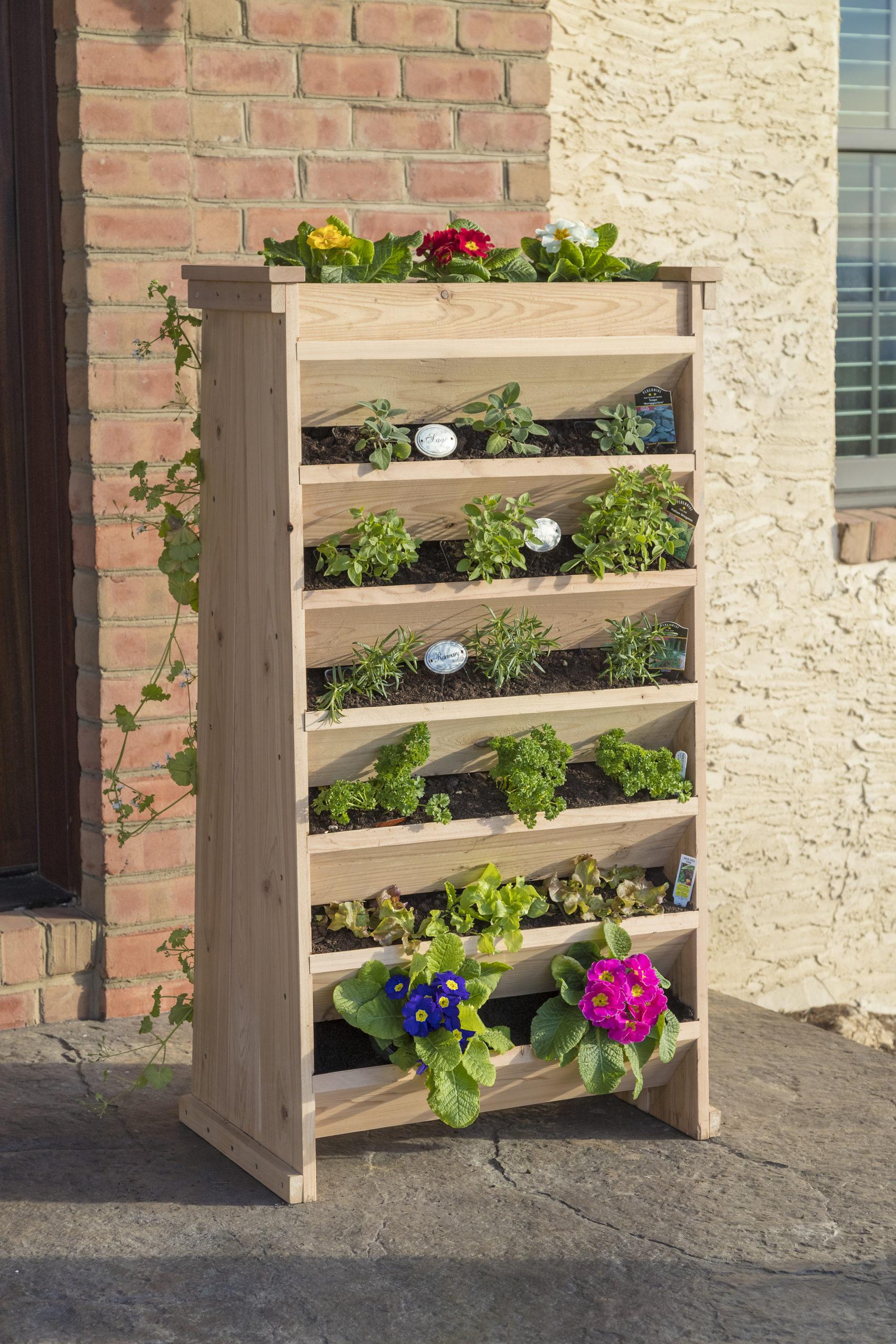 Use vertical planters to maximize space and greenery in your backyard