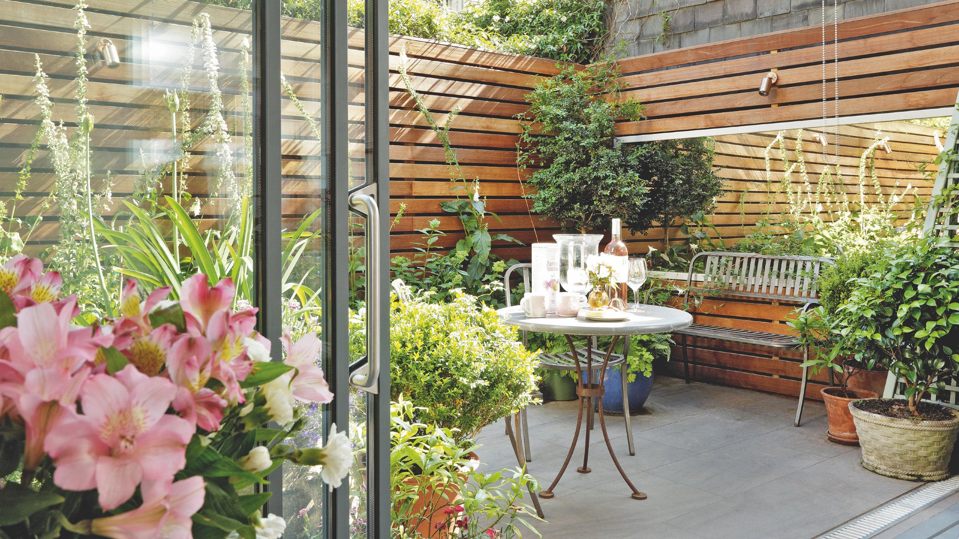 Use mirrors to create the illusion of space in your small backyard