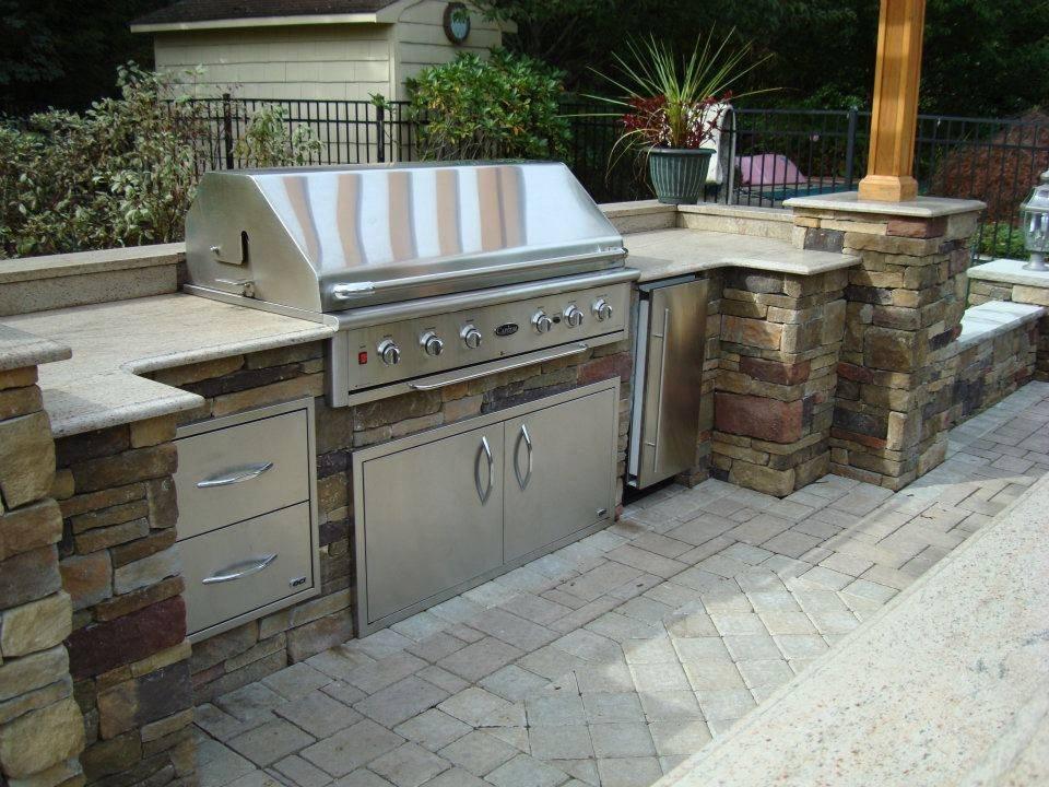 Use an outdoor kitchen for gourmet meals in your backyard
