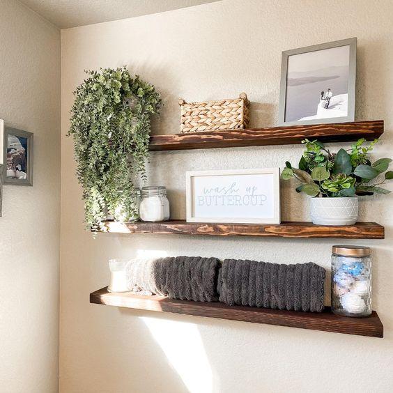 Open shelving displays neatly arranged towels and decor in your Farmhouse Bathroom