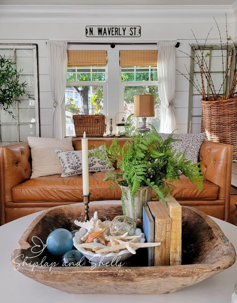 Incorporate driftwood accents for a beachy vibe in your Earthy Living Room