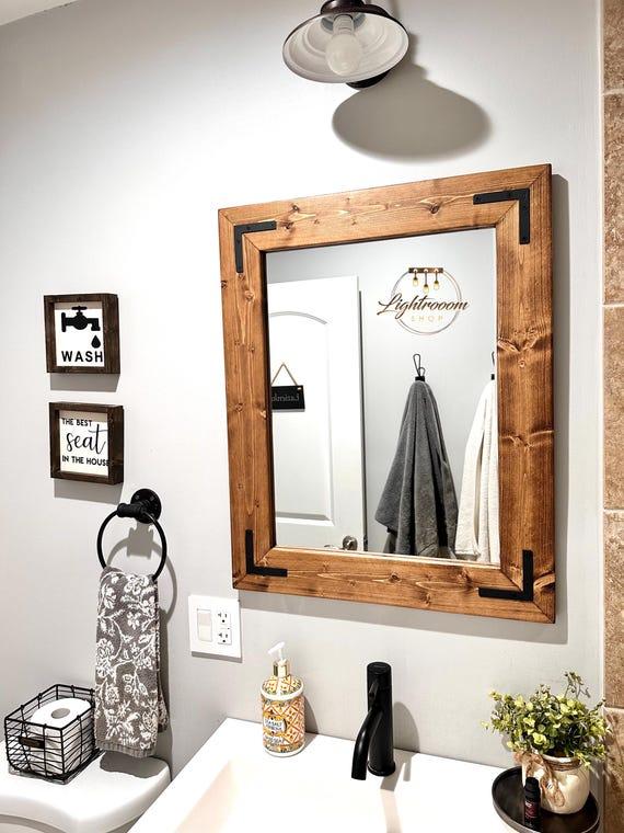 Unique mirrors reflect the⁤ rustic charm of your chalet bathroom