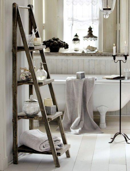 Vintage ladder as a towel holder in chalet ‌bathroom charm