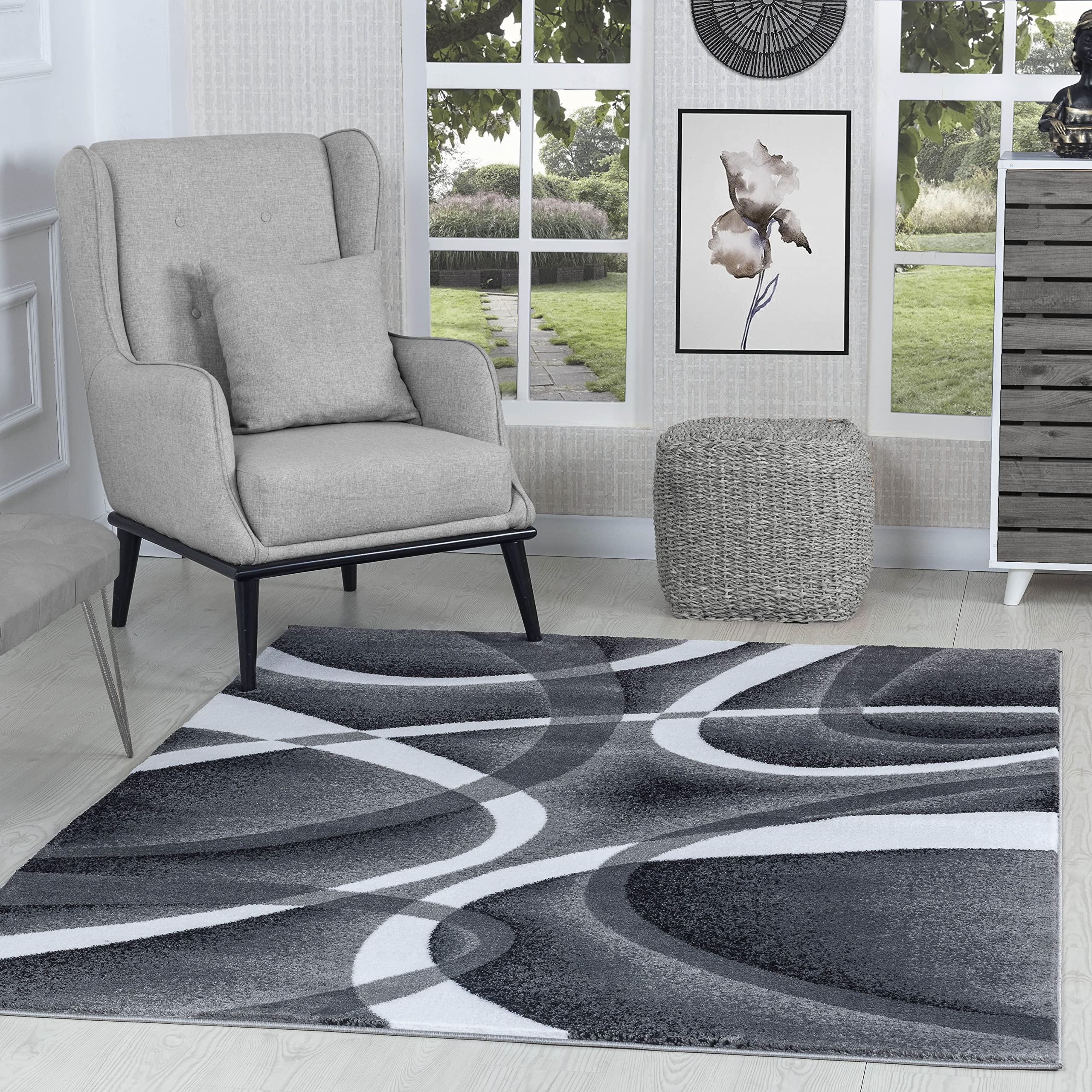 Create distinct zones with area rugs in ⁤your contemporary living room design