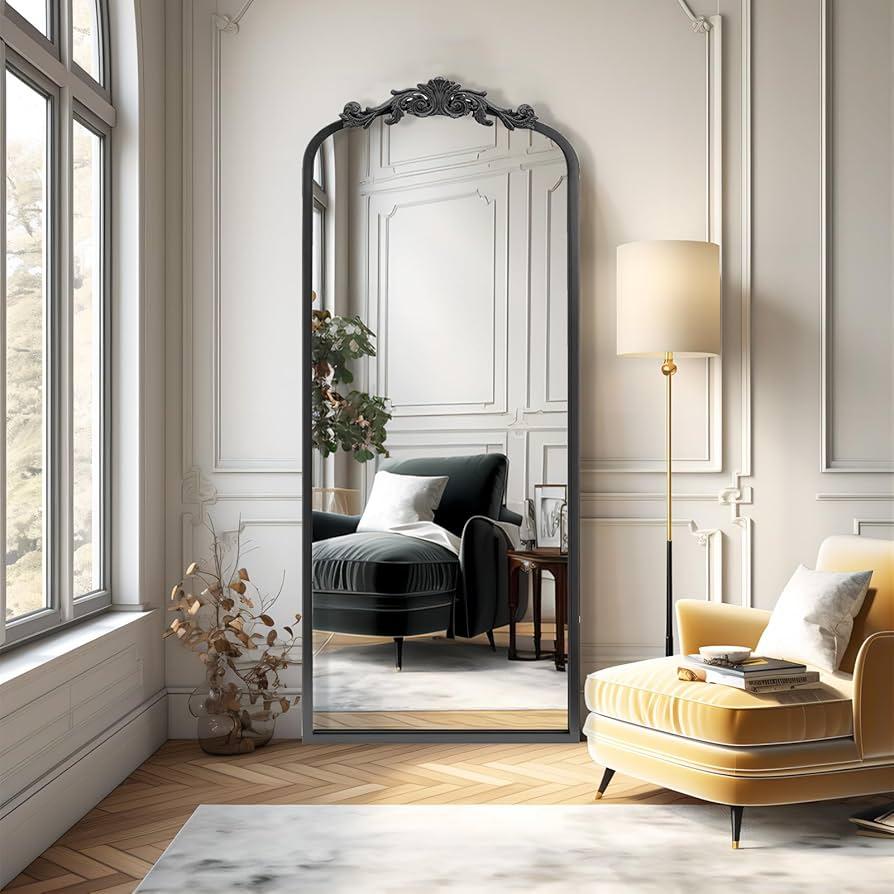Hang a vintage mirror to reflect light and create an illusion of space in your Vintage Living Room