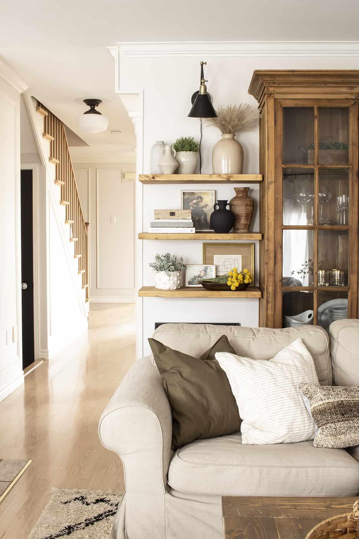 An open shelf displaying natural elements harmonizes with your Earthy Living Room style