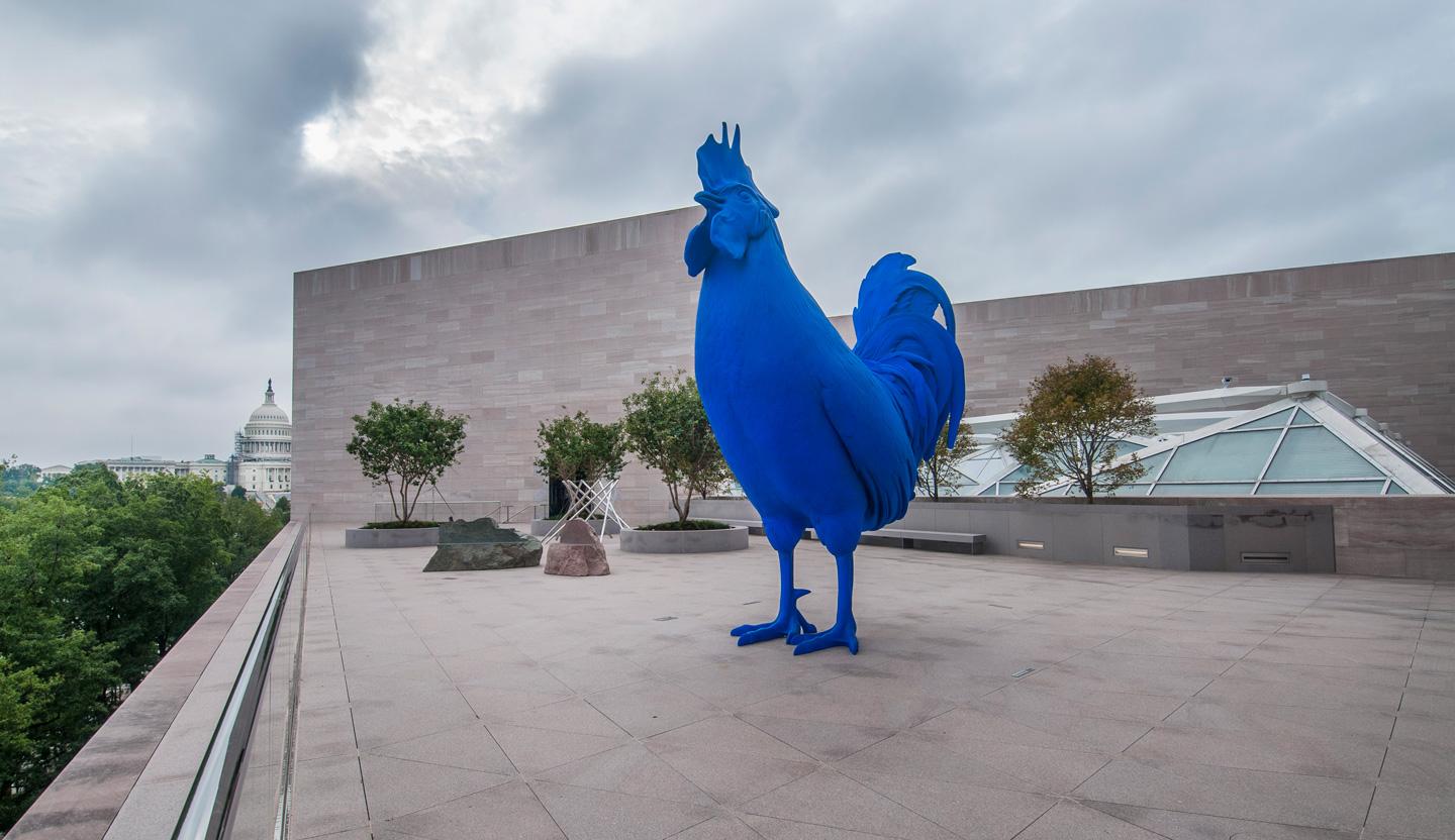 Integrate unique blue sculptures for an artistic flair