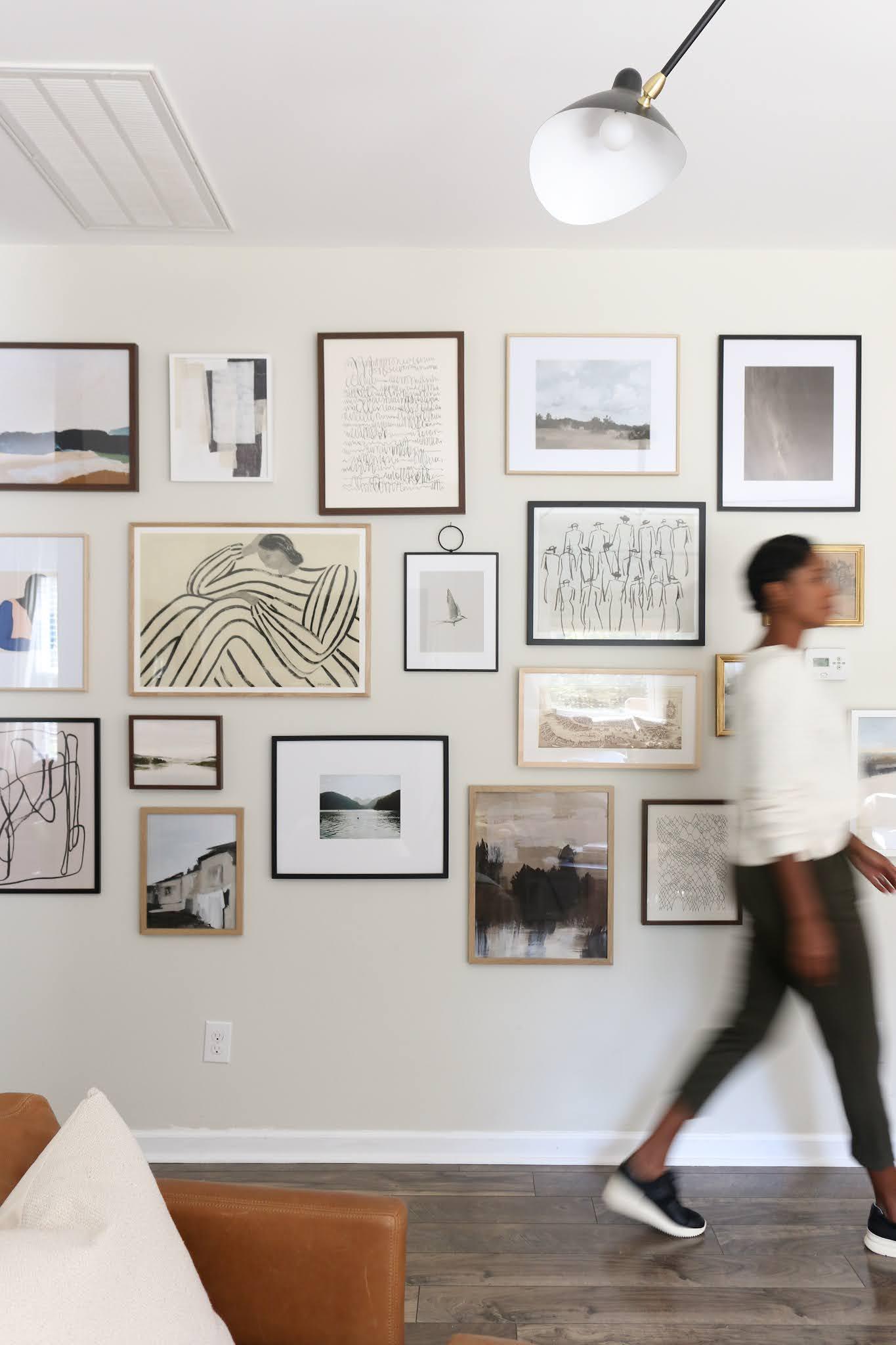 Curate a gallery wall featuring your favorite photos in your contemporary living room