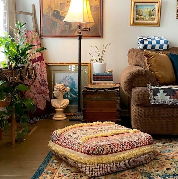 Create multifunctional spaces with poufs for seating in your Boho Living Room