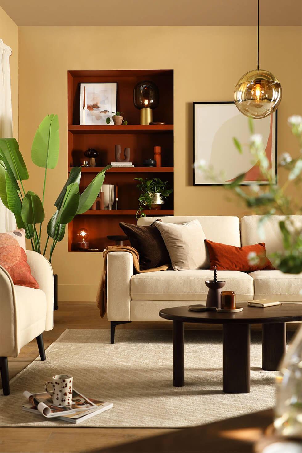 Use earthy tones like terracotta and olive green in your earthy living room decor
