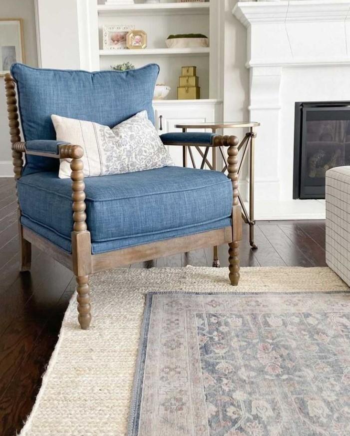 Layer ‌rugs in complementing blues for added texture in your living room