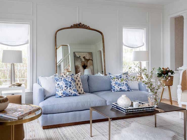 Use mirrored furniture to reflect light in your blue living room