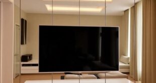 Reflecting Style: Transform Your Space with a Mirrored TV Wall Design